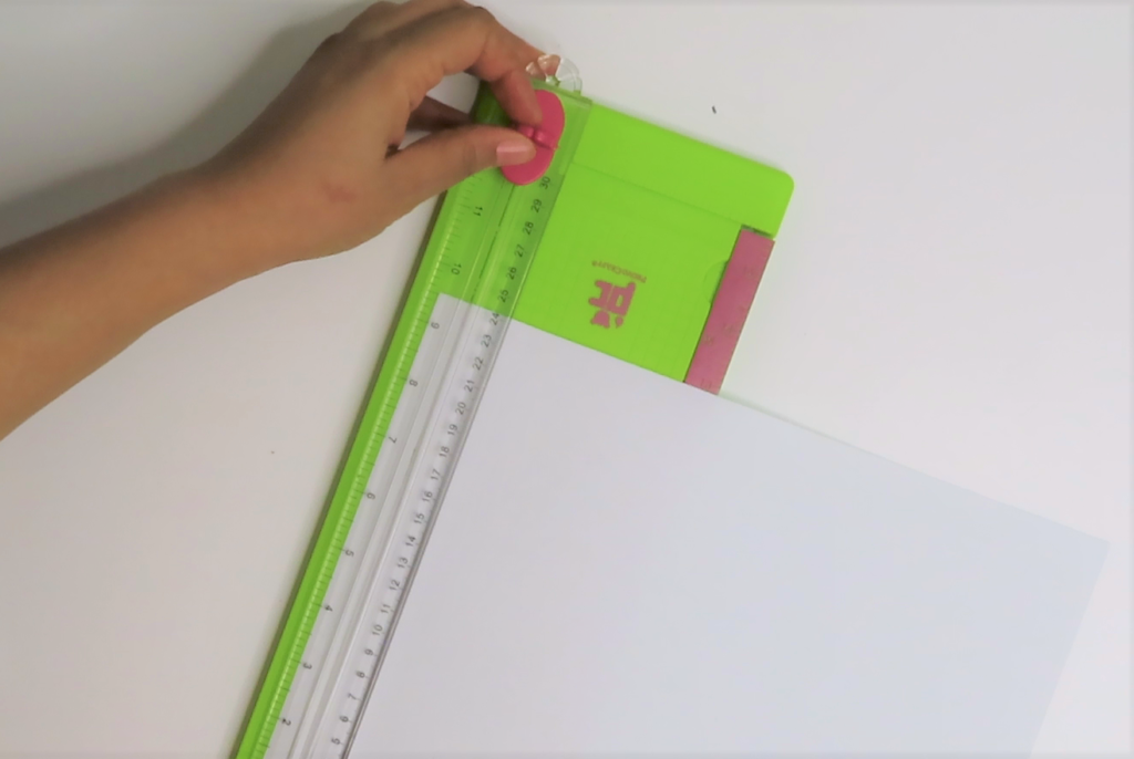 Measure and cut cardstock paper with paper trimmer | Colorful DIY Wall Decor for a Stylish Girl's Room