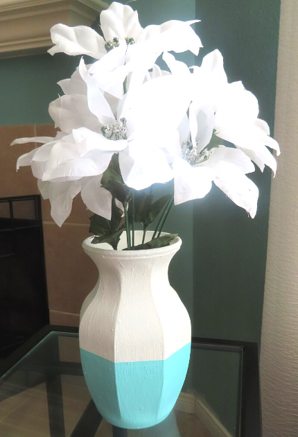 The finished vase sitting on an end table