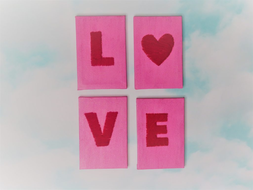 4 Valentine's Day Canvases That Spell Out the Word Love arranged in a 2X2 pattern | A Valentine's Day Decor Idea You'll Fall In Love With
