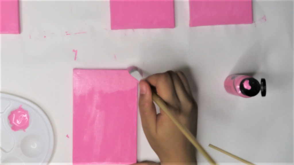 Paint each canvas with pink acrylic craft paint | A Valentine's Day Decor Idea You'll Fall In Love With