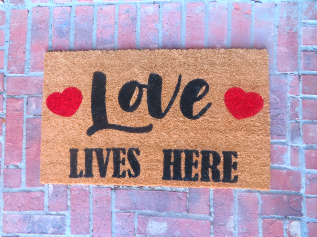 Finished DIY Doormat laying on a brick floor
