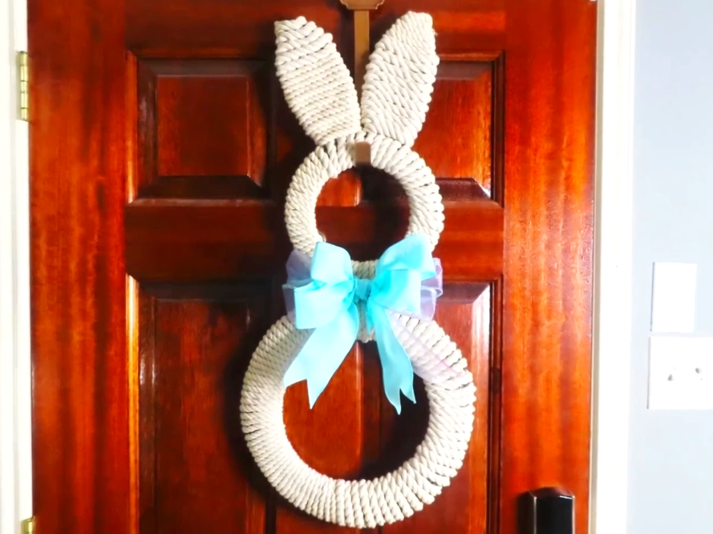 Completed bunny wreath hanging on front door