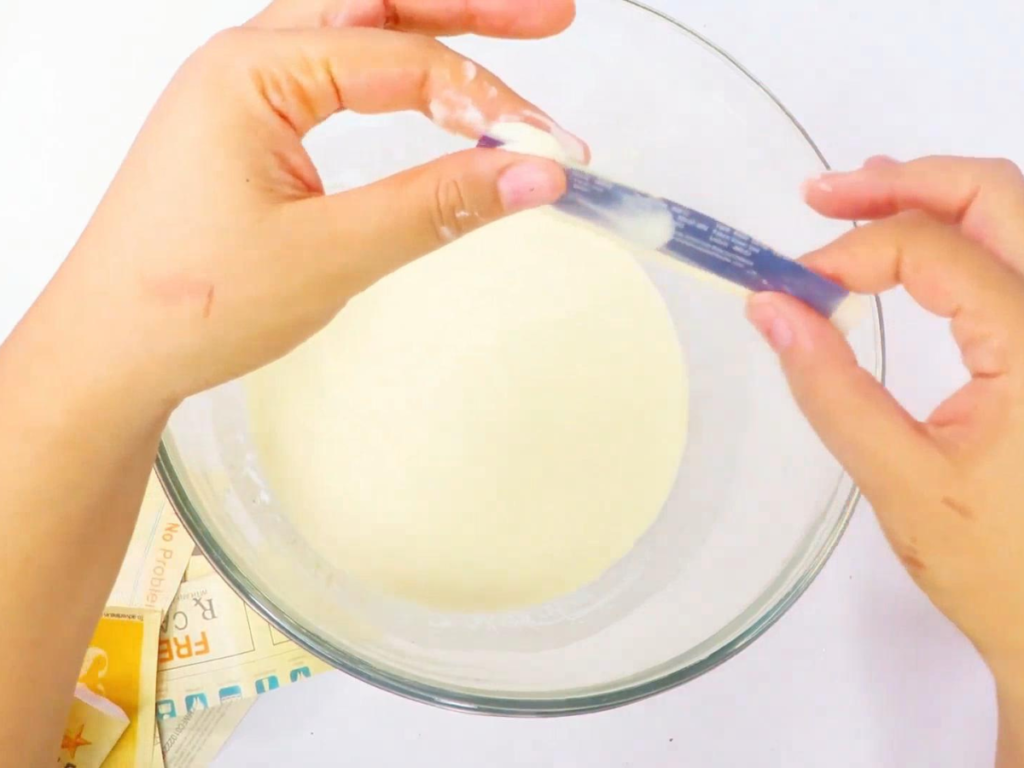 Pull on the strip of paper gently to remove the excess flour and water mixture