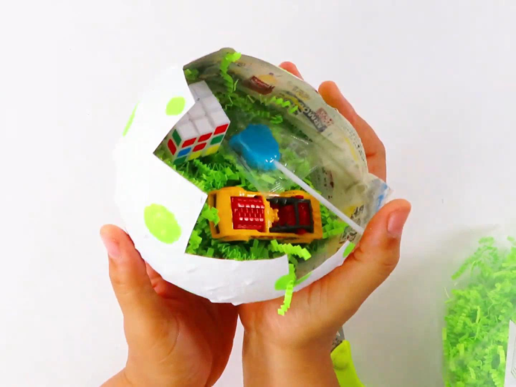 Fill the dinosaur egg with crinkle paper to use for party favors