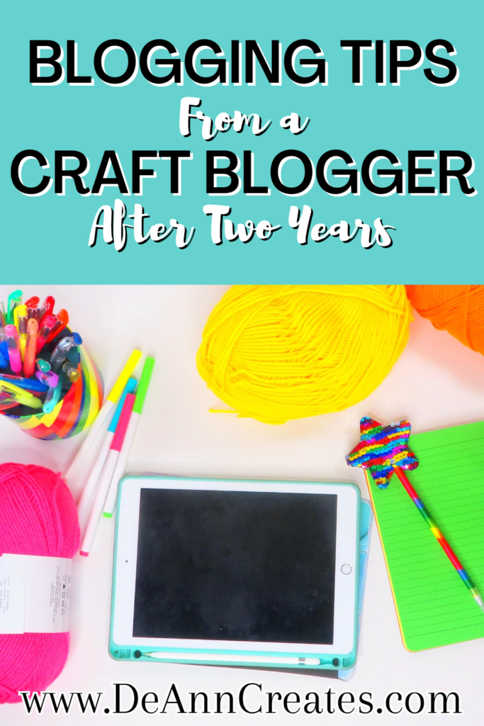 This image shows a Pinterest pin entitle "Blogging Tips from a Craft Blogger After Two Years". The image on the Pinterest pin shows an iPad laying on a white surface with a colorful sequin pin laying on a lime green notebook. There are several balls of yarn surrounding the iPad as well as a colorful organizer filled with markers.