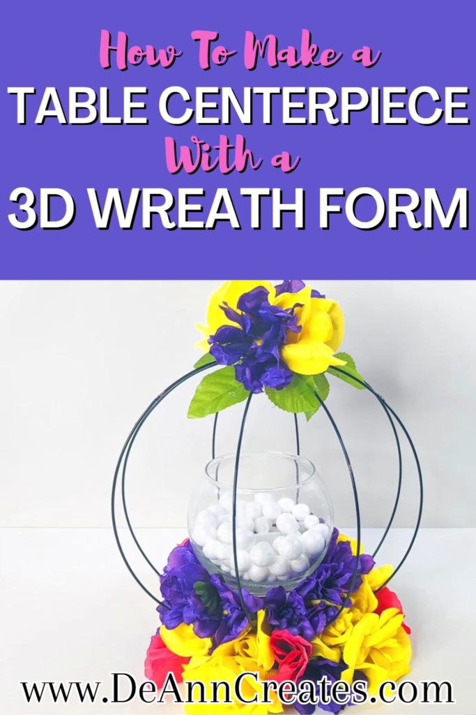 This is a Pinterest Pin for "How to Make a Table Centerpiece with a 3D Wreath form." The bottom of the pin shows the 3D round centerpiece with flowers all around the base and a few on top. It also has a candle holder in the center filled with vase filler and a battery-operated candle.