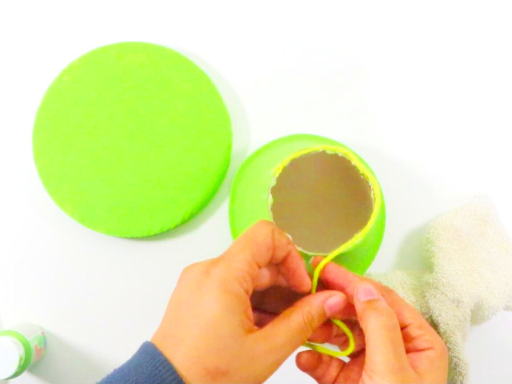 How to Make a Leprechaun Trap for St. Patrick's Day Fun | Glue yarn around the edge of the leprechaun hat to cover up the edges