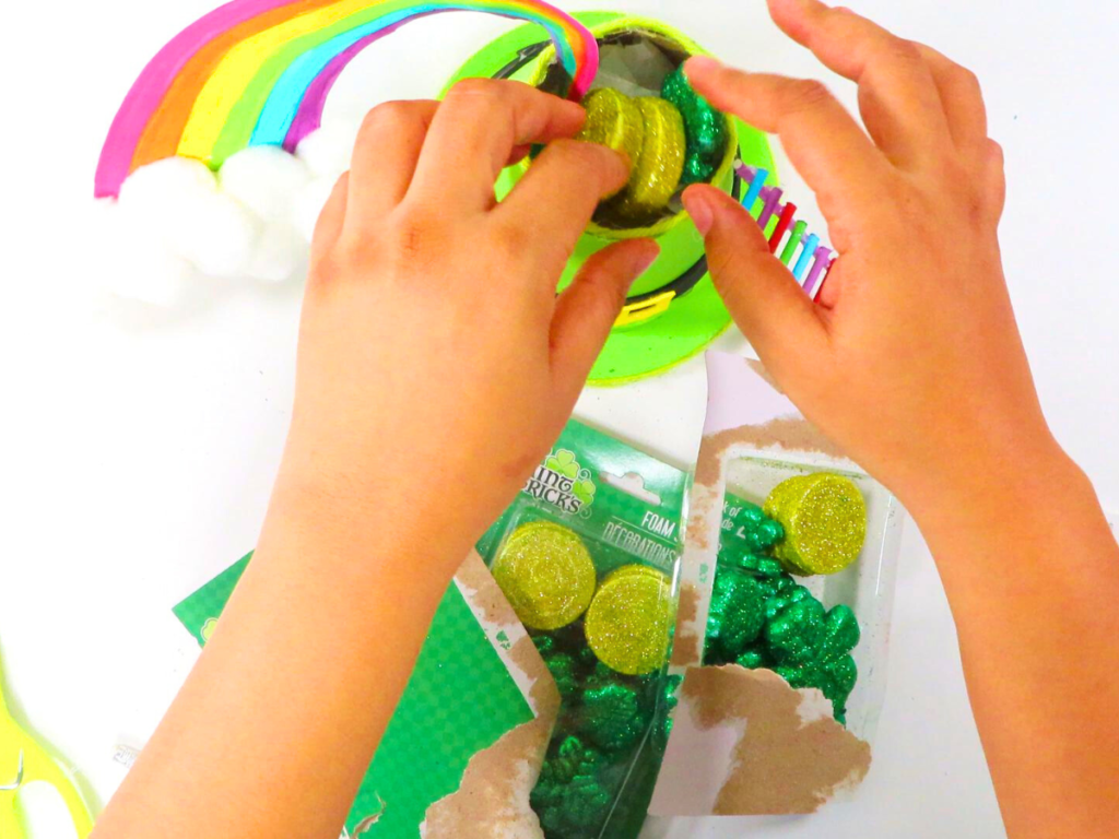 How to Make a Leprechaun Trap for St. Patrick's Day Fun | Place sparkly gold coins and clovers inside your hat as "bait".