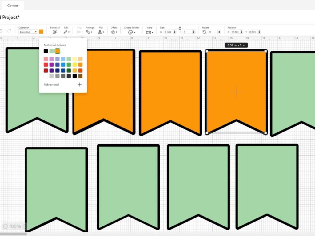 This image shows the pennants the banner being created in Cricut Design Space after the color of the pennants being changed to green and orange | How to Make a Banner for Halloween That's Cute and Spooky