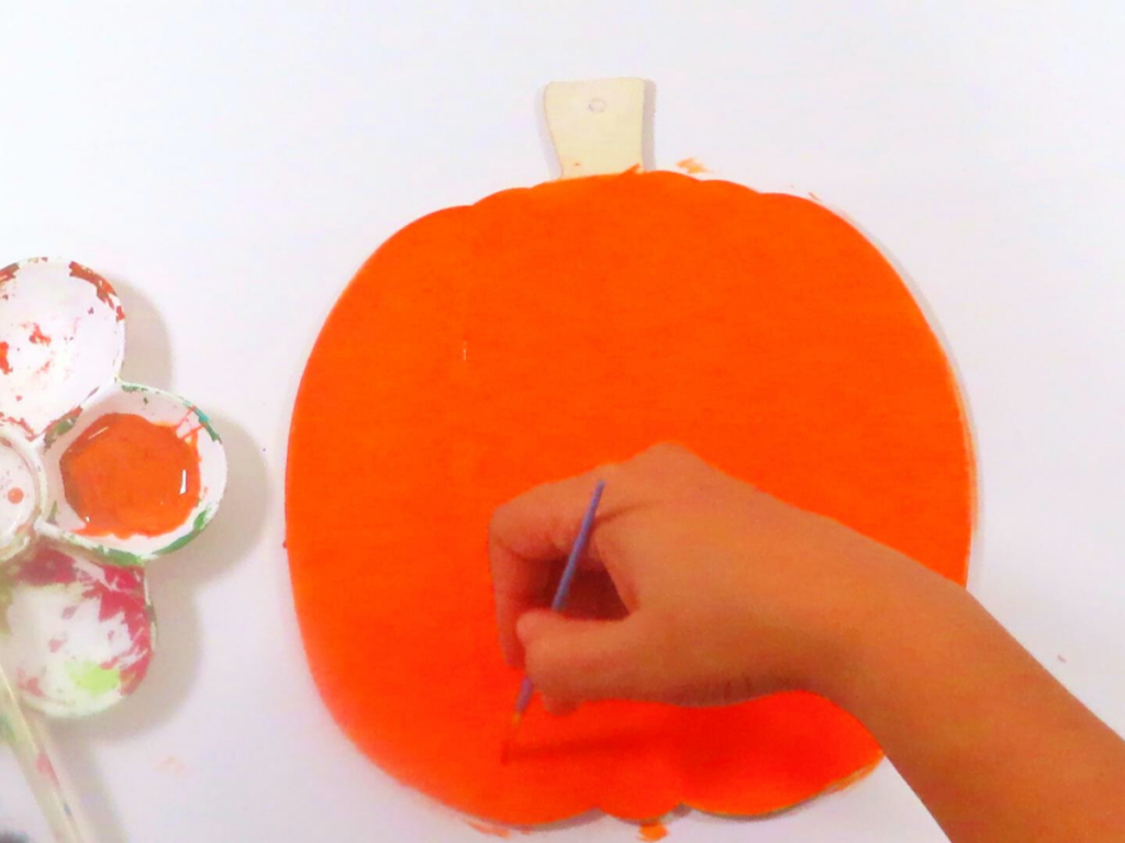 Using brown paint to add shading to the wooden pumpkin | DIY Fall Decor You'll Love Making with Simple Decor